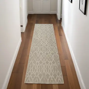 8' Tan and Ivory Geometric Power Loom Worn Faded Runner Rug