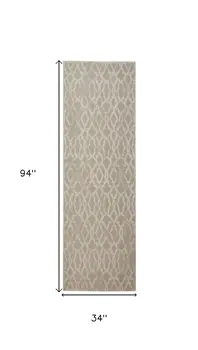 8' Tan and Ivory Geometric Power Loom Worn Faded Runner Rug