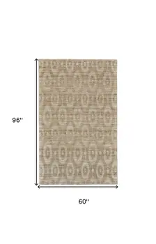 5' X 8' Tan and Ivory Geometric Hand Woven Area Rug