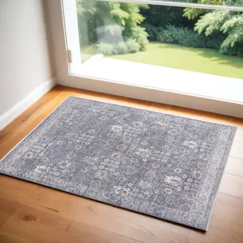 3' X 5' Gray and Blue Floral Power Loom Worn Faded Area Rug With Fringe