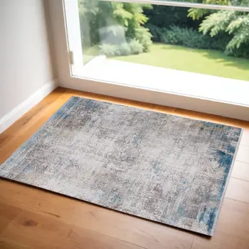 3' X 5' Ivory Gray and Blue Abstract Power Loom Area Rug With Fringe