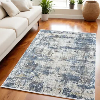 5' X 8' Ivory Tan and Blue Abstract Power Loom Area Rug With Fringe