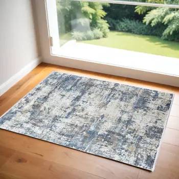 2' X 3' Ivory Tan and Blue Abstract Power Loom Area Rug With Fringe