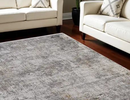 13' X 20' Ivory Taupe and Gray Abstract Power Loom Distressed Area Rug With Fringe