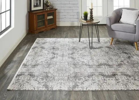 3' X 5' Ivory Taupe and Gray Abstract Power Loom Distressed Area Rug With Fringe