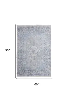5' X 8' Gray Blue and Ivory Oriental Hand Woven Distressed Area Rug With Fringe