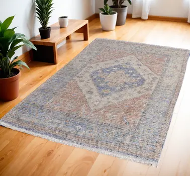 4' X 6' Red Blue and Ivory Abstract Hand Woven Distressed Area Rug With Fringe