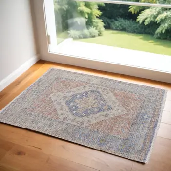 2' X 3' Red Blue and Ivory Abstract Hand Woven Distressed Area Rug With Fringe