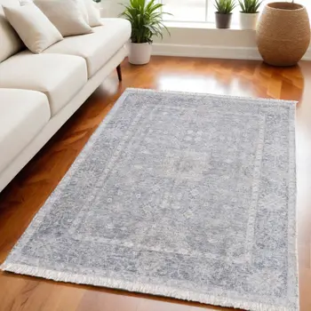 5' X 8' Gray Blue and Taupe Abstract Hand Woven Distressed Area Rug With Fringe