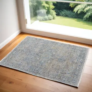 2' X 3' Gray Blue and Tan Abstract Hand Woven Distressed Area Rug With Fringe