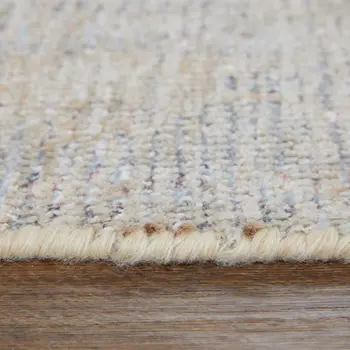 4' X 6' Ivory Tan and Blue Floral Hand Woven Distressed Area Rug With Fringe