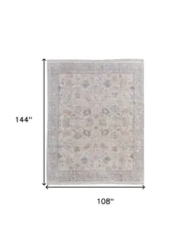 9' X 12' Ivory Tan and Blue Floral Hand Woven Distressed Area Rug With Fringe