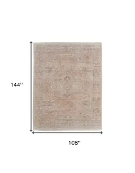 9' X 12' Tan Orange and Ivory Oriental Hand Woven Distressed Area Rug With Fringe