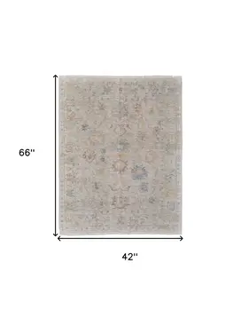 4' X 6' Tan Brown and Blue Floral Hand Woven Distressed Area Rug With Fringe
