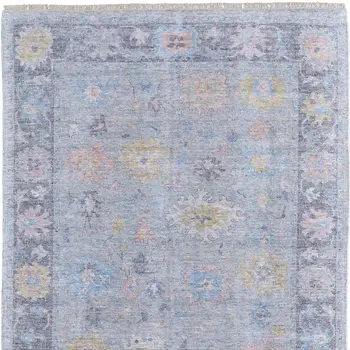 8' X 10' Orange Blue and Gold Floral Hand Woven Distressed Area Rug With Fringe