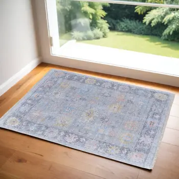 2' X 3' Orange Blue and Gold Floral Hand Woven Distressed Area Rug With Fringe