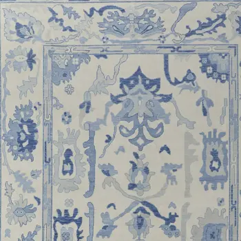 8' X 10' Ivory and Blue Wool Floral Hand Knotted Area Rug With Fringe
