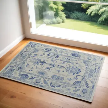 2' X 3' Ivory and Blue Wool Floral Hand Knotted Area Rug With Fringe