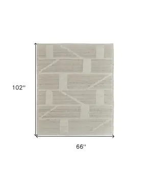 6' X 9' Tan and Ivory Wool Geometric Hand Woven Area Rug