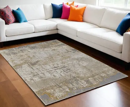 5' X 8' Ivory Gray and Brown Abstract Power Loom Worn Faded Area Rug