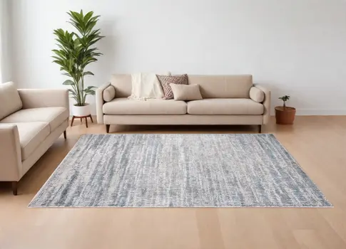 8' X 10' Ivory Gray and Blue Abstract Power Loom Area Rug