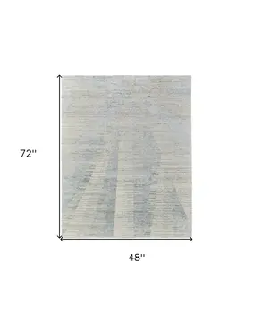 4' X 6' Ivory and Blue Abstract Hand Knotted Worn Faded Area Rug