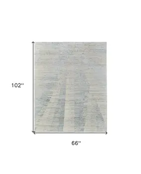 6' X 9' Ivory and Blue Abstract Hand Knotted Worn Faded Area Rug