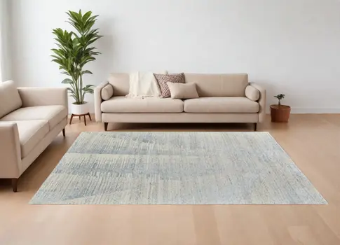 9' X 13' Ivory and Blue Abstract Hand Knotted Worn Faded Area Rug