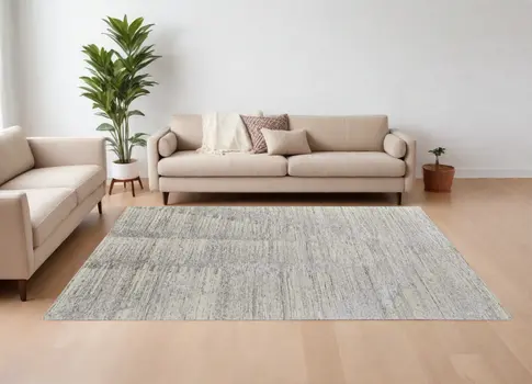6' X 9' Ivory and Gray Abstract Hand Knotted Worn Faded Area Rug