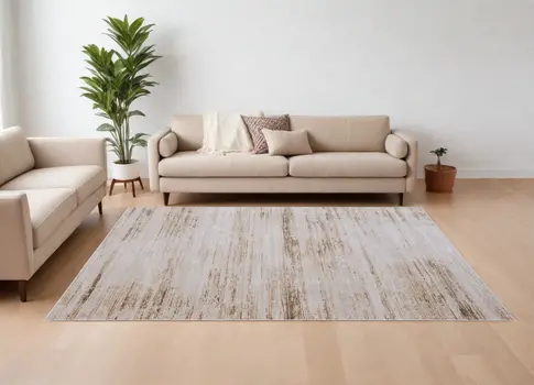 9' X 13' Ivory and Tan Abstract Power Loom Worn Faded Area Rug