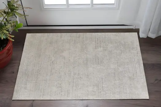 2' X 3' Gray and Ivory Abstract Hand Woven Worn Faded Area Rug