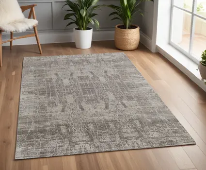 4' X 6' Gray and Silver Abstract Hand Woven Worn Faded Area Rug