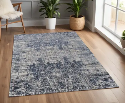 4' X 6' Blue and Ivory Abstract Hand Woven Worn Faded Area Rug