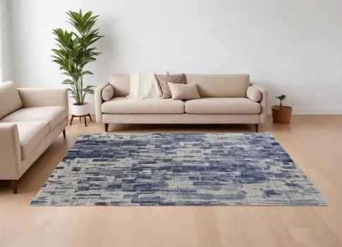 8' X 10' Blue and Ivory Abstract Hand Woven Worn Faded Area Rug