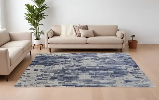 9' X 12' Blue and Ivory Abstract Hand Woven Distressed Area Rug
