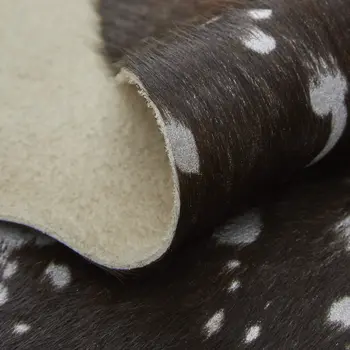 8' X 10' Brown and Silver Cowhide Animal Print Power Loom Area Rug