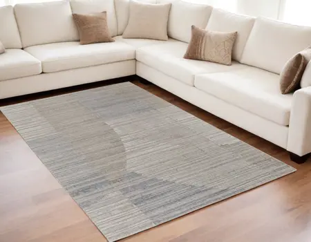 5' X 8' Tan and Blue Abstract Hand Woven Worn Faded Area Rug