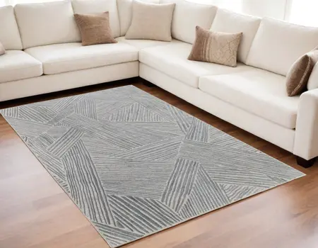 5' X 8' Green and Ivory Abstract Hand Woven Area Rug