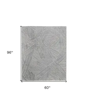 5' X 8' Green and Ivory Abstract Hand Woven Area Rug