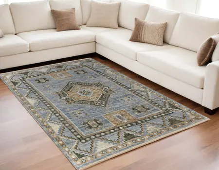 5' X 8' Ivory Tan and Blue Wool Oriental Hand Knotted Area Rug With Fringe