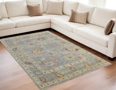 5' X 8' Light Blue and Taupe Wool Floral Hand Knotted Area Rug With Fringe