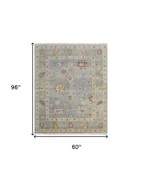 5' X 8' Light Blue and Taupe Wool Floral Hand Knotted Area Rug With Fringe