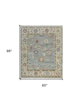 5' X 8' Blue Ivory and Yellow Wool Floral Hand Knotted Area Rug With Fringe