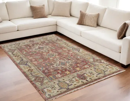 5' X 8' Ivory Red and Gold Wool Oriental Hand Knotted Area Rug With Fringe