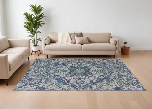 6' X 9' Green Blue and Ivory Oriental Power Loom Area Rug