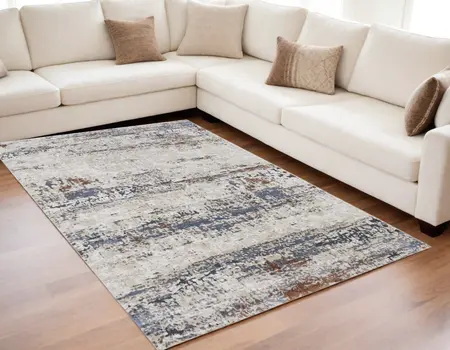 5' X 8' Gray Blue and Ivory Abstract Power Loom Area Rug