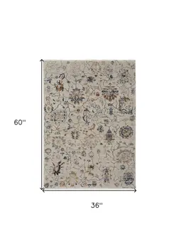 3' X 5' Blue Gray and Brown Floral Power Loom Worn Faded Area Rug With Fringe