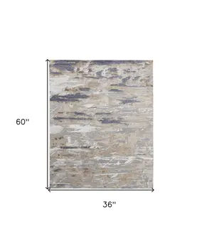 3' X 5' Tan Ivory and Blue Abstract Power Loom Worn Faded Area Rug
