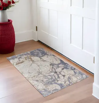 3' X 5' Tan and Blue Abstract Power Loom Worn Faded Area Rug