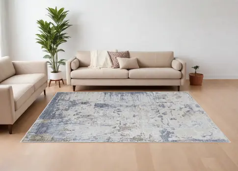 8' X 10' Ivory Gray and Blue Abstract Power Loom Worn Faded Area Rug